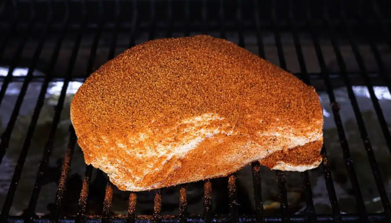Smoked turkey breast cooking in smoker